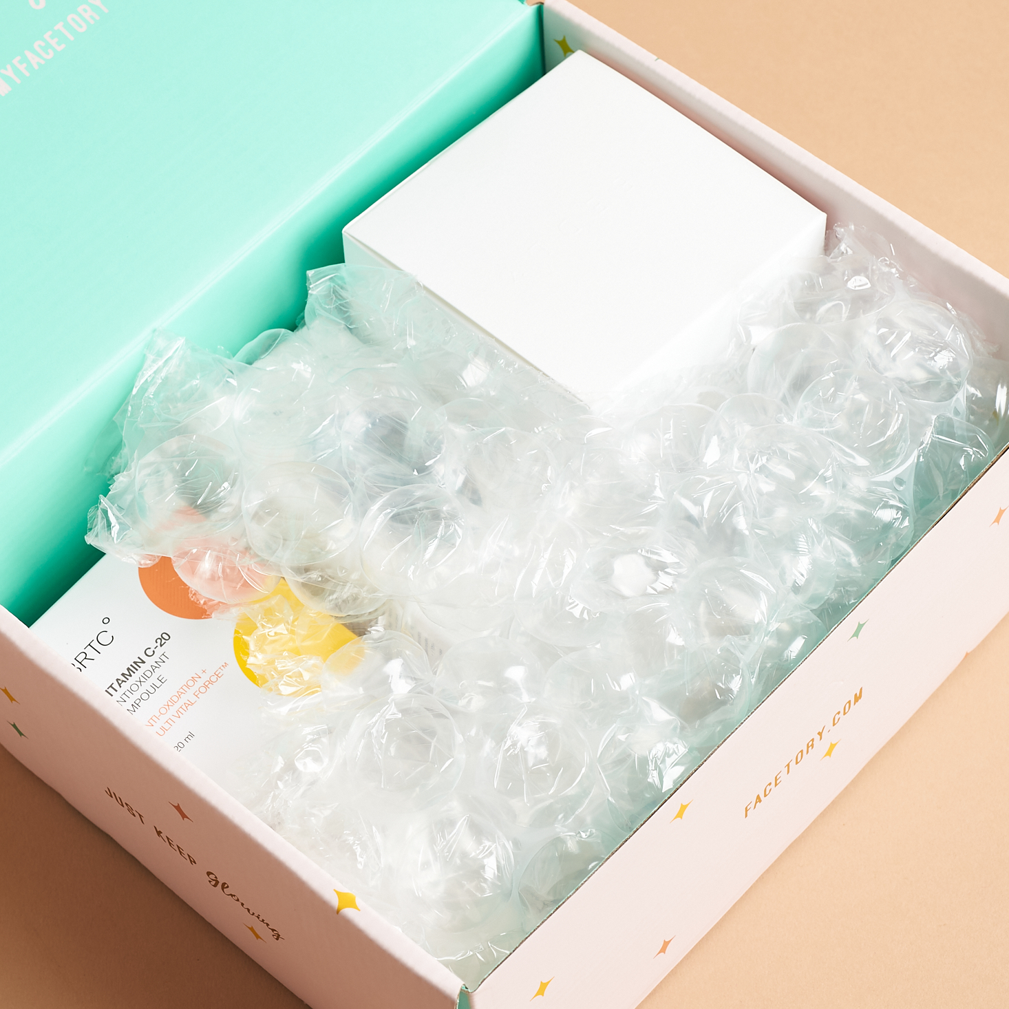 open box showing bubble wrap covering products inside