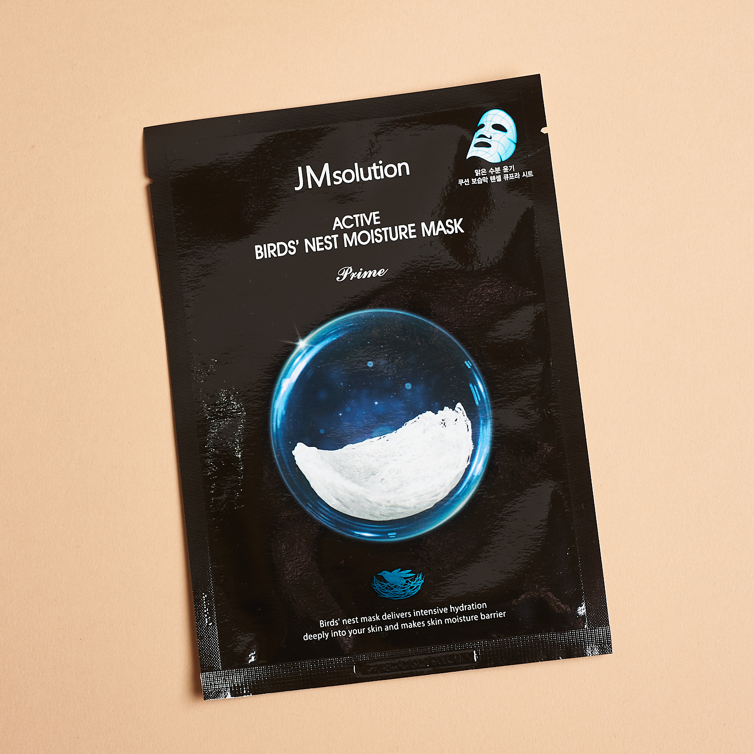 black sheet mask showing blue and white water drop