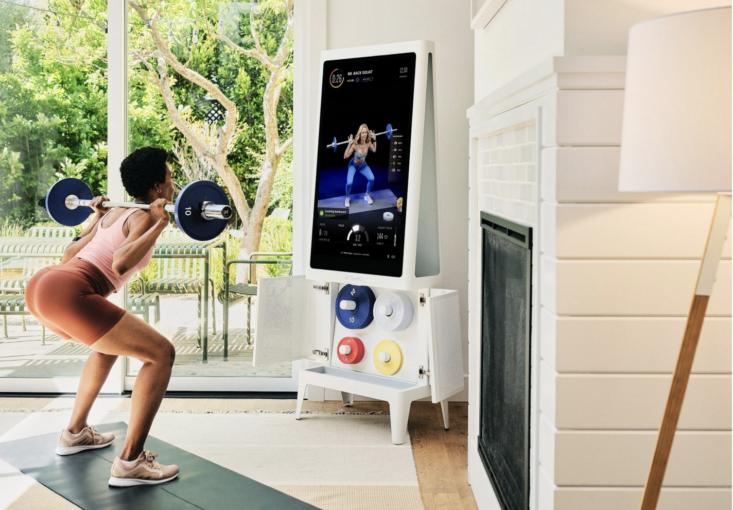 woman working out with Tempo home gym