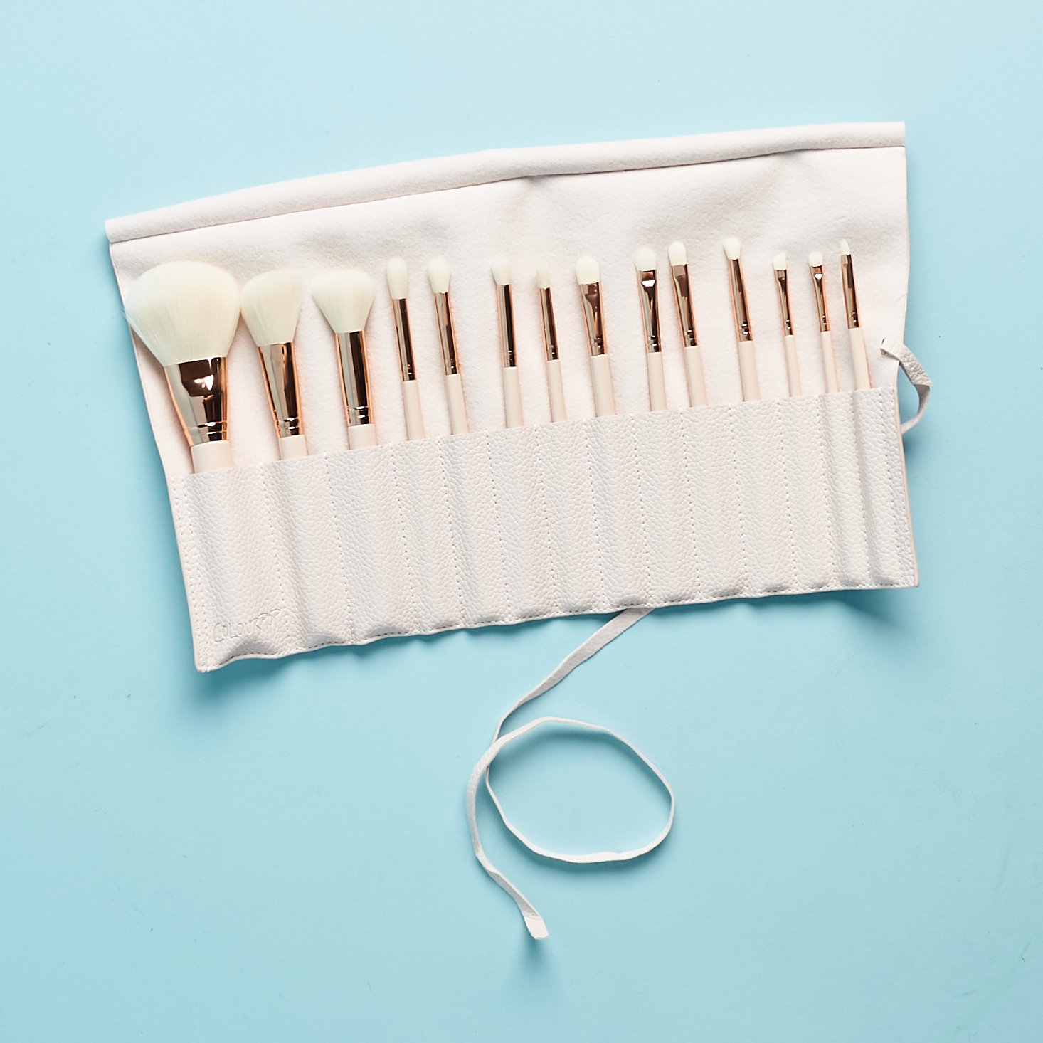 faux lettre brush roll, unrolled to show the 14 brushes