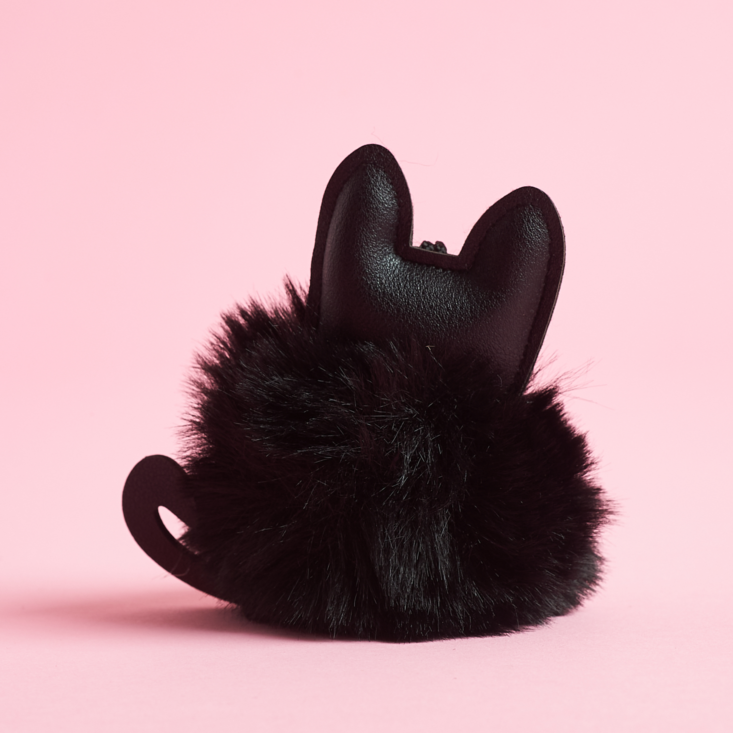 alternate view of black cat key chain with fluffy puff