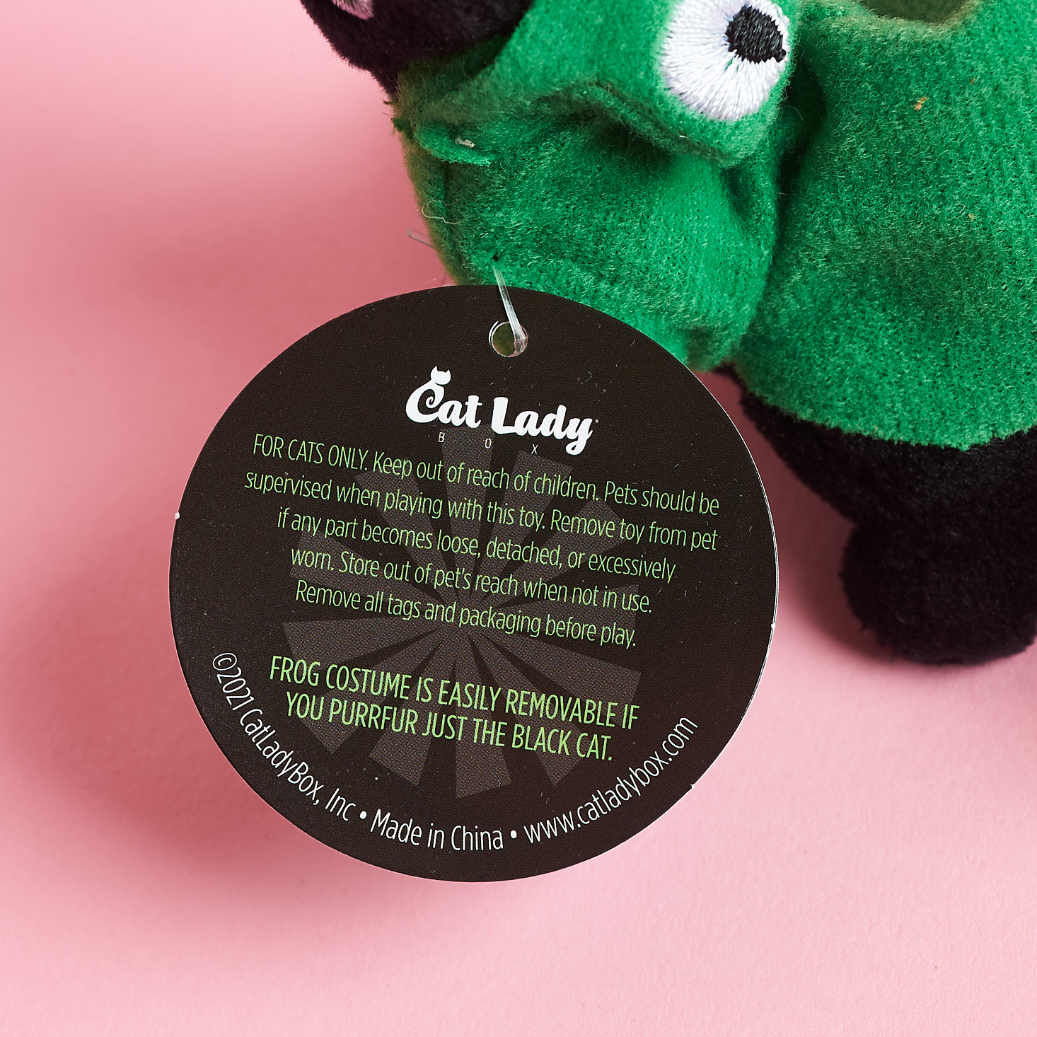 closeup of tag on cat frog costume toy