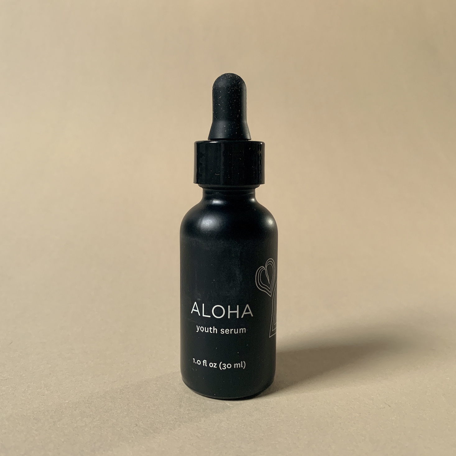 Honua Aloha Serum, black glass bottle with dropper