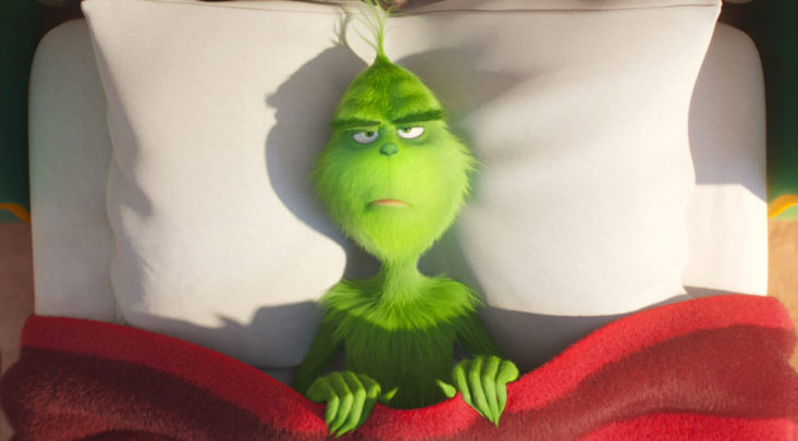 the grinch in bed resisting Christmas