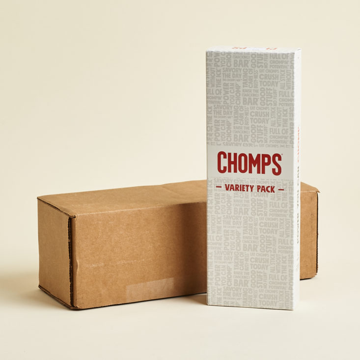 cardboard box with Chomps box standing up beside it