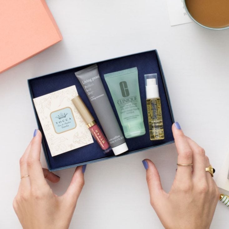 photo of woman's hands with open Birchbox