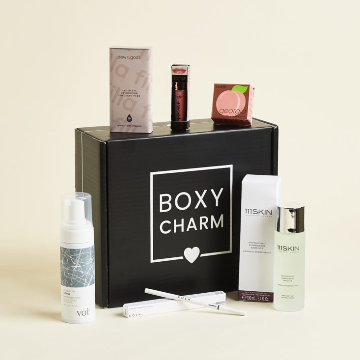 boxycharm box with products around it