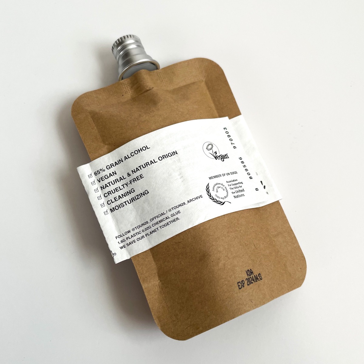 alternate view of brown pouch with white label
