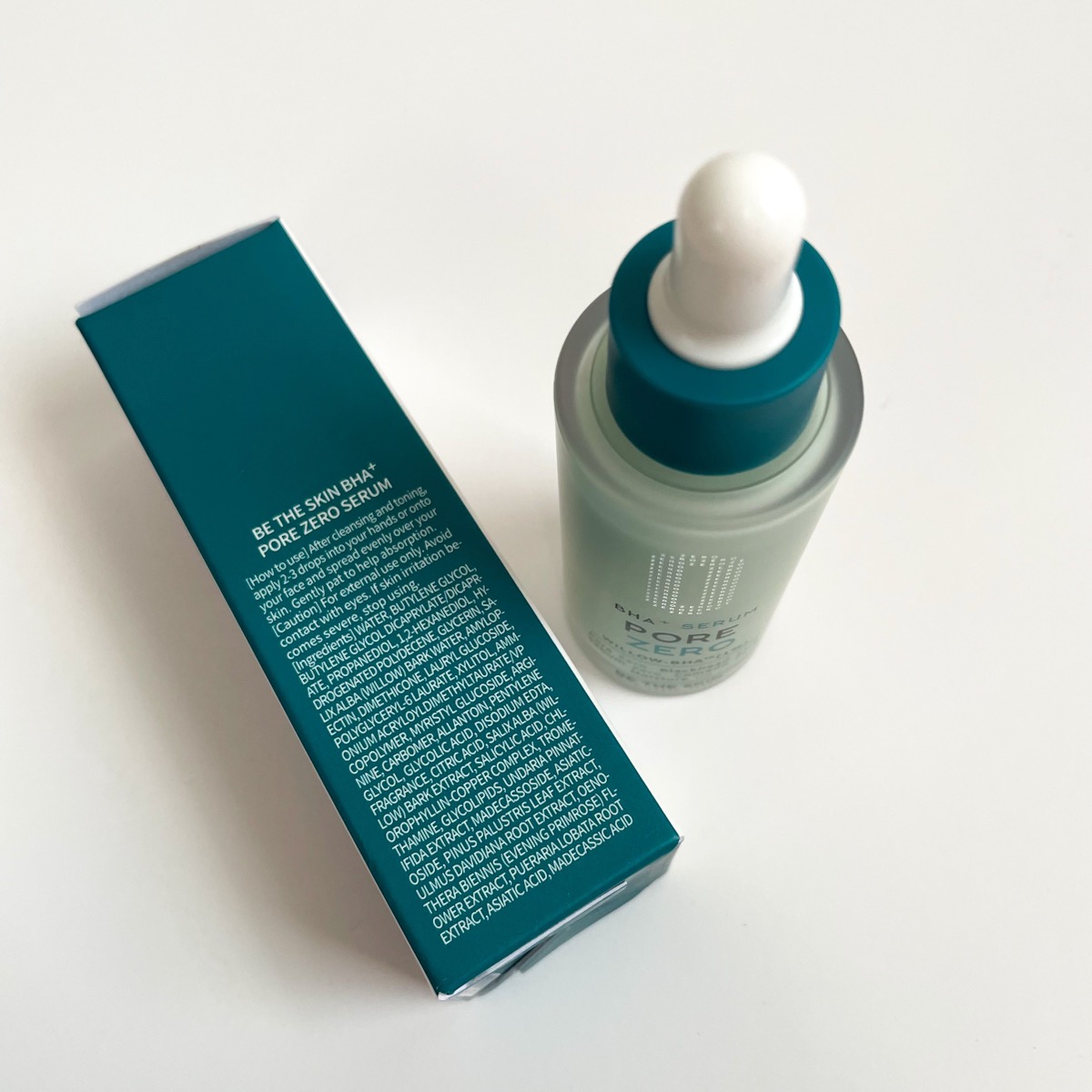 alternate view of serum and packaging showing dropper top and ingredients list