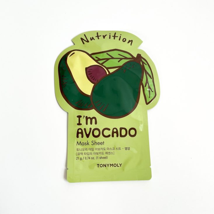 green sheet mask with avocado on it