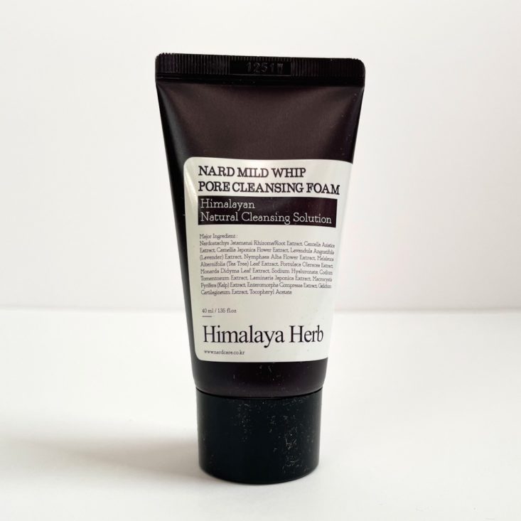 black and white tube of cleanser