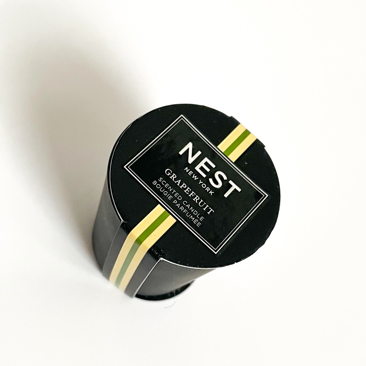 alternate view showing the top of the candle which shows nest label covering the top