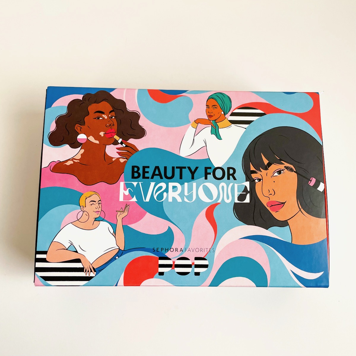 colorful box showing four women of different ethnicities and styles