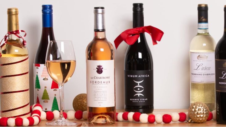 photo of a variety of wines and holiday decorations from Wine Insiders