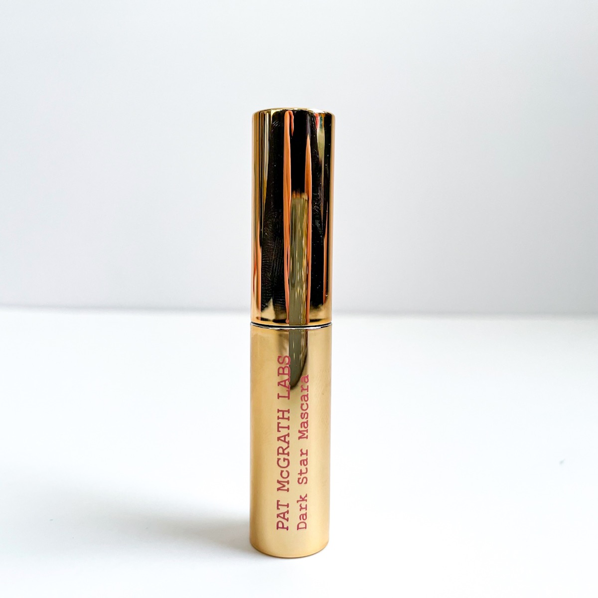 metallic gold mascara tube, closed