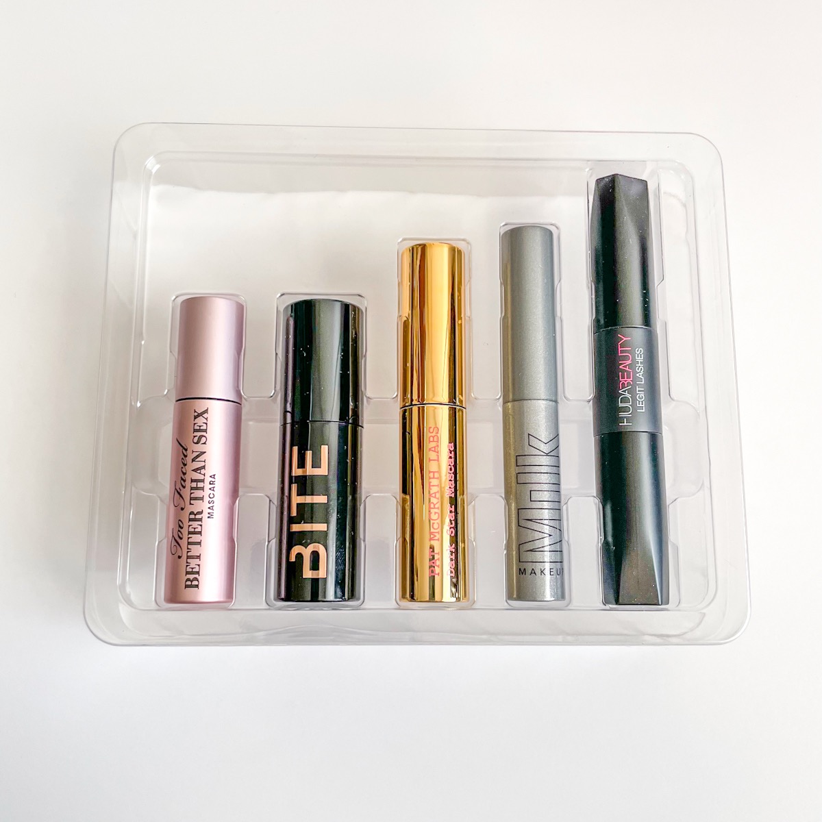 clear plastic liner with five mascaras nestled neatly inside