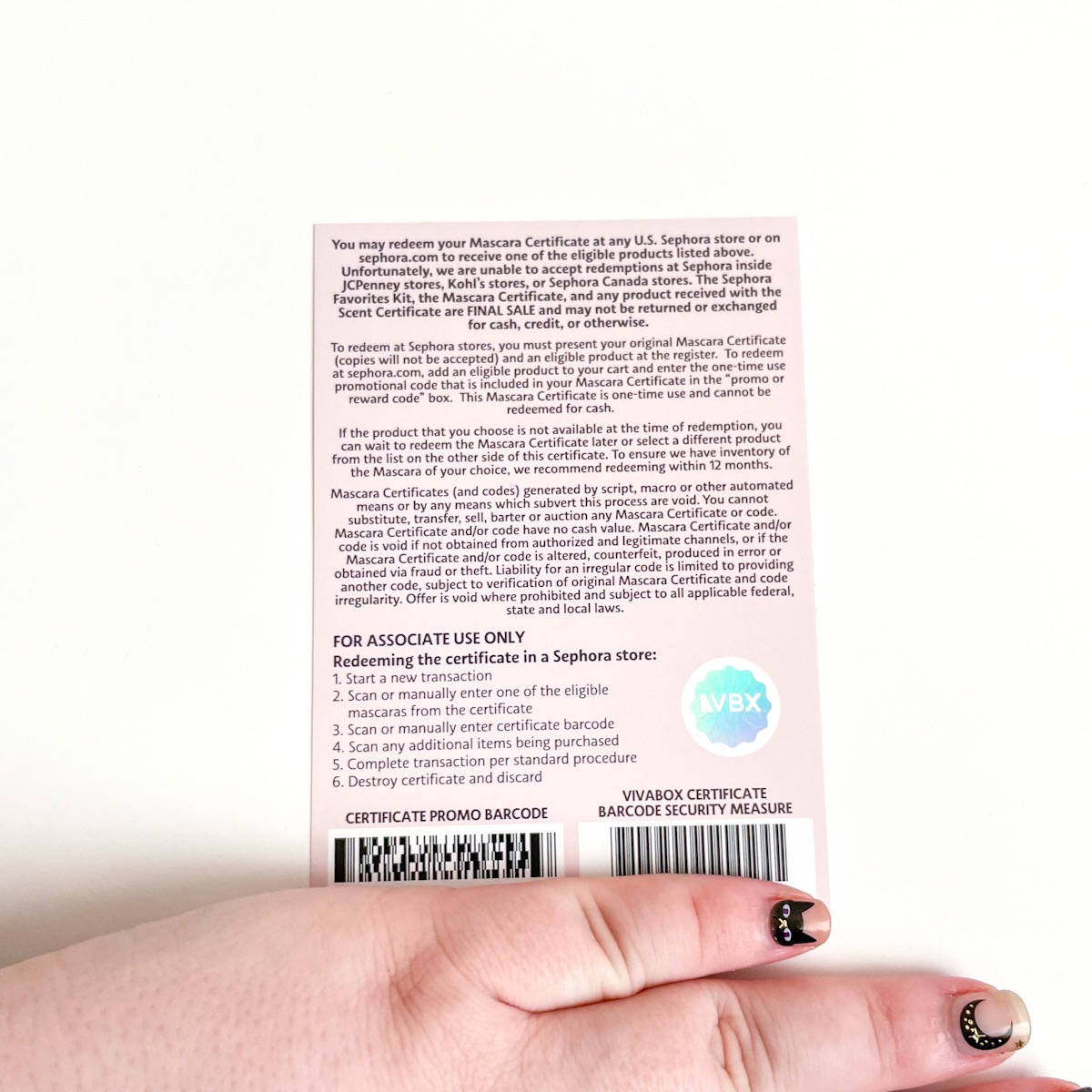 back of voucher with hand covering promo code