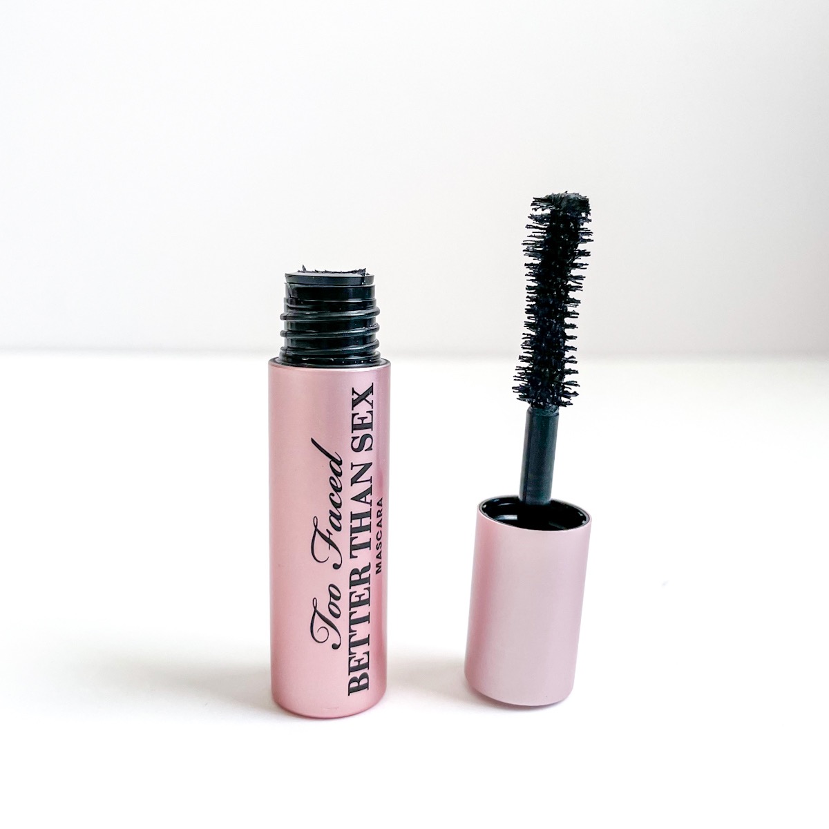 opened pink tube of mascara showing hourglass mascara brush