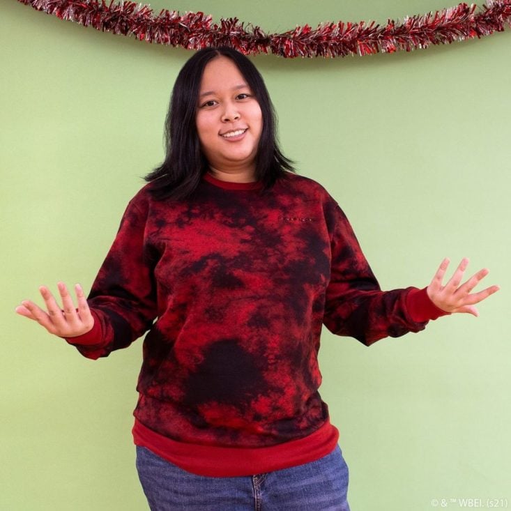 woman wearing friends red sweater