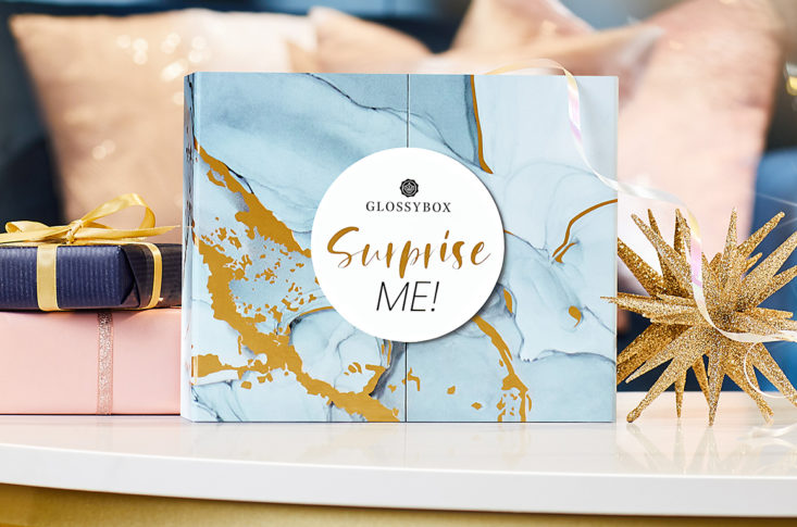 glossybox holiday box with surprise me on the label