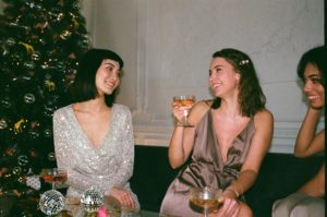 women in dresses celebrating holidays