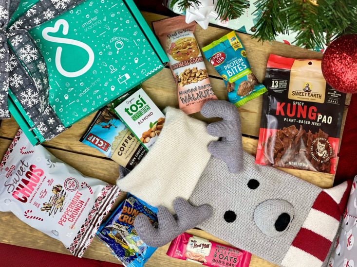 snacksack holiday box with snacks around it