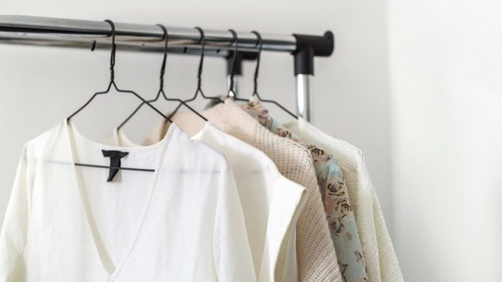 photo of clothing hanging on a metal rack