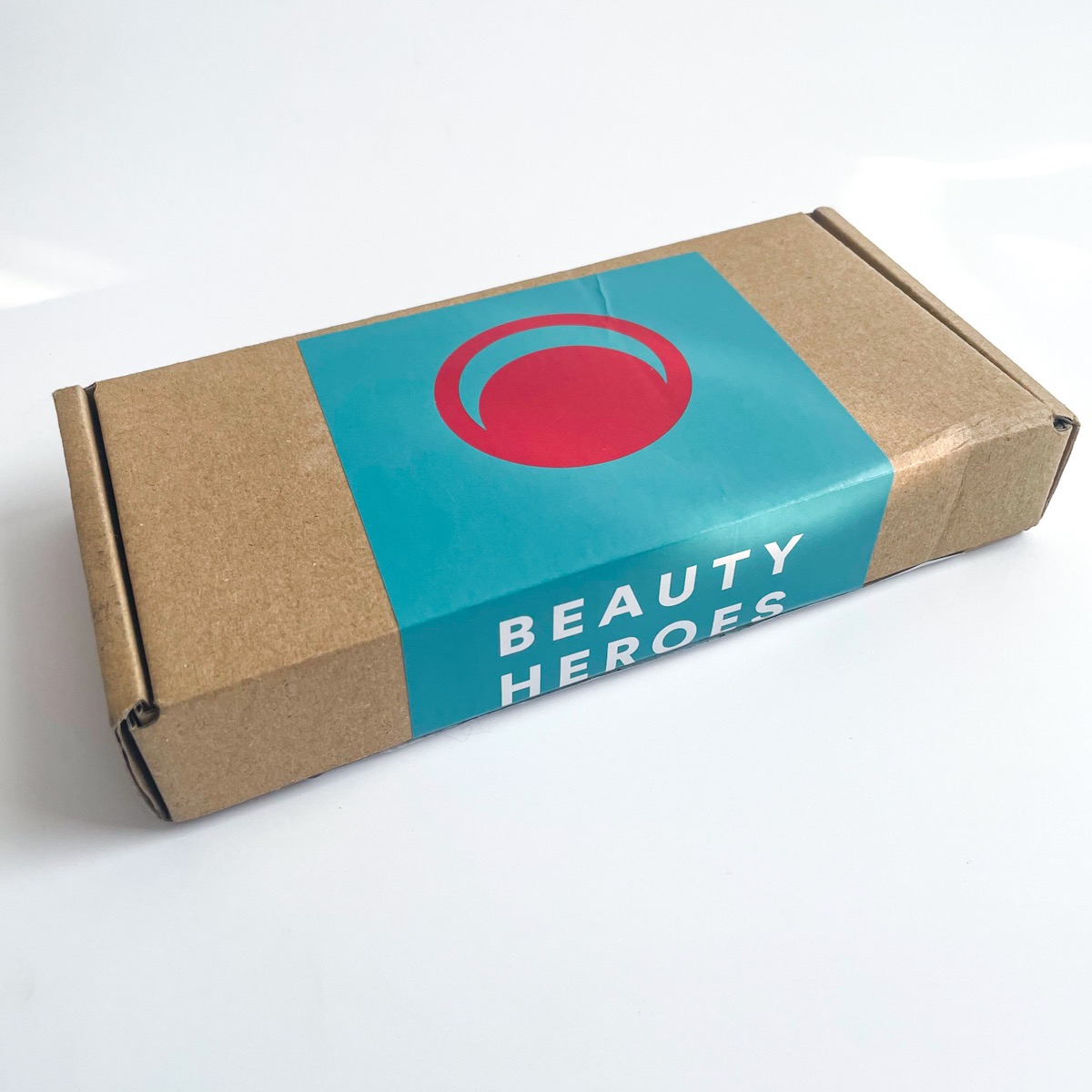 brown Kraft box with blue and red label