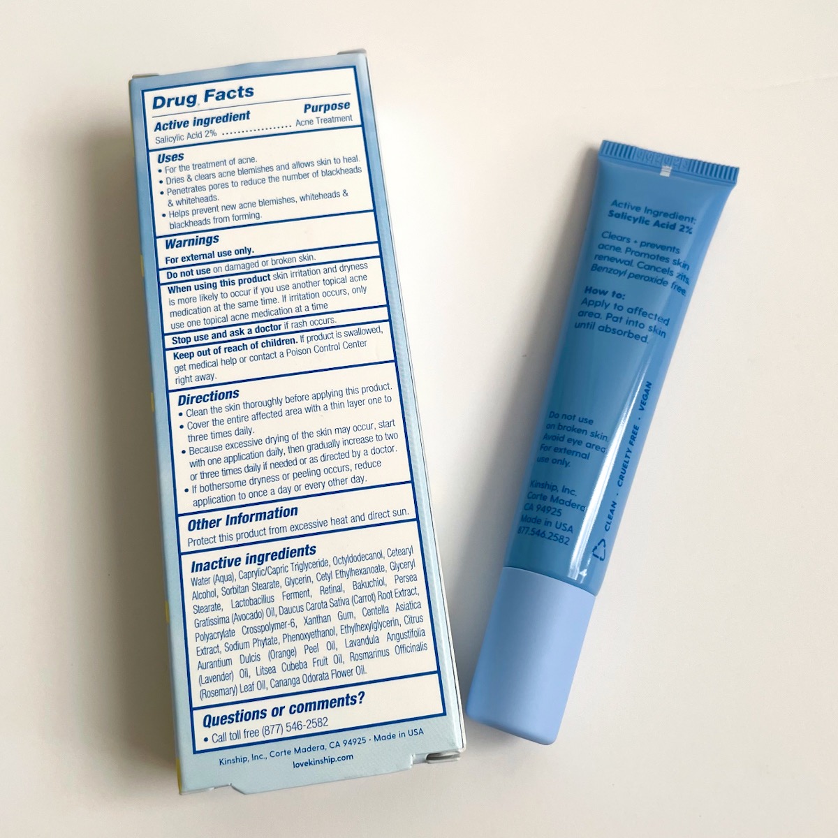 back of blue tube and back of blue box listing drug facts