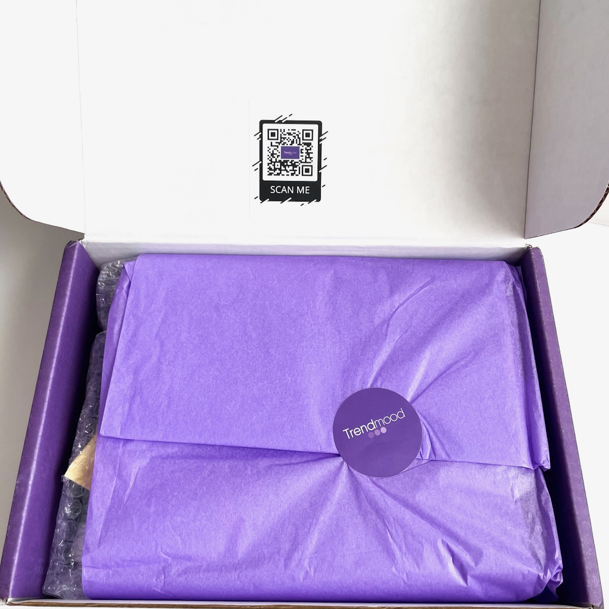 opened Trendmood Box showing purple tissue paper