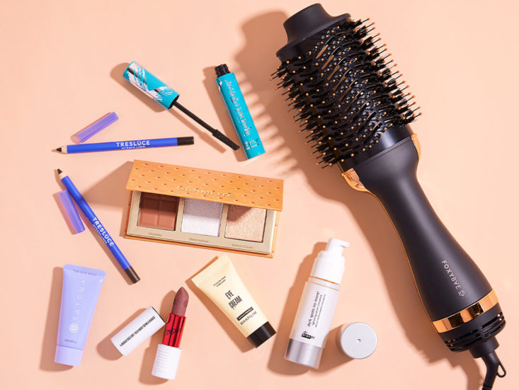 ipsy items including hairbrush and other beauty products
