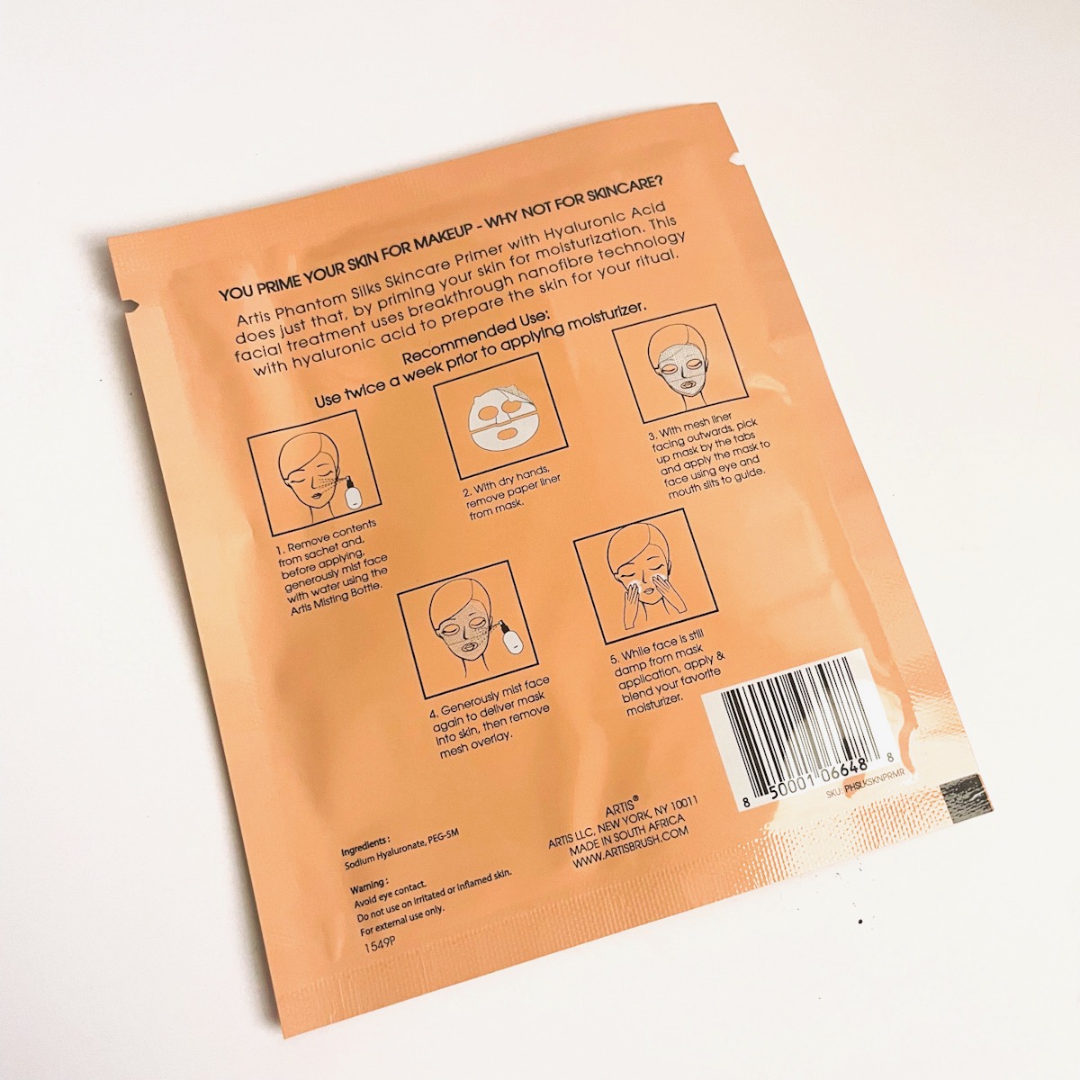 back of orange sheet mask with instructions