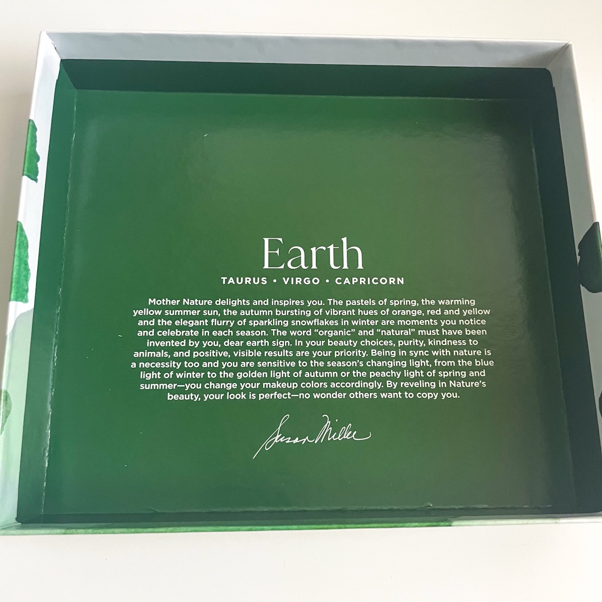 lid of green box describing earth signs