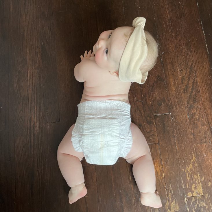 Baby doing tummy time in Coterie diaper