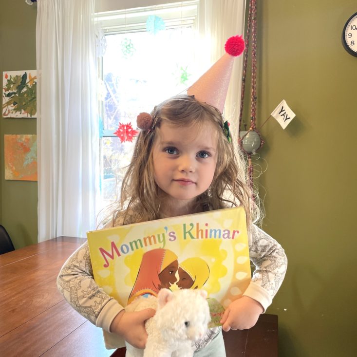 Girl holding Mommy's Khimar book