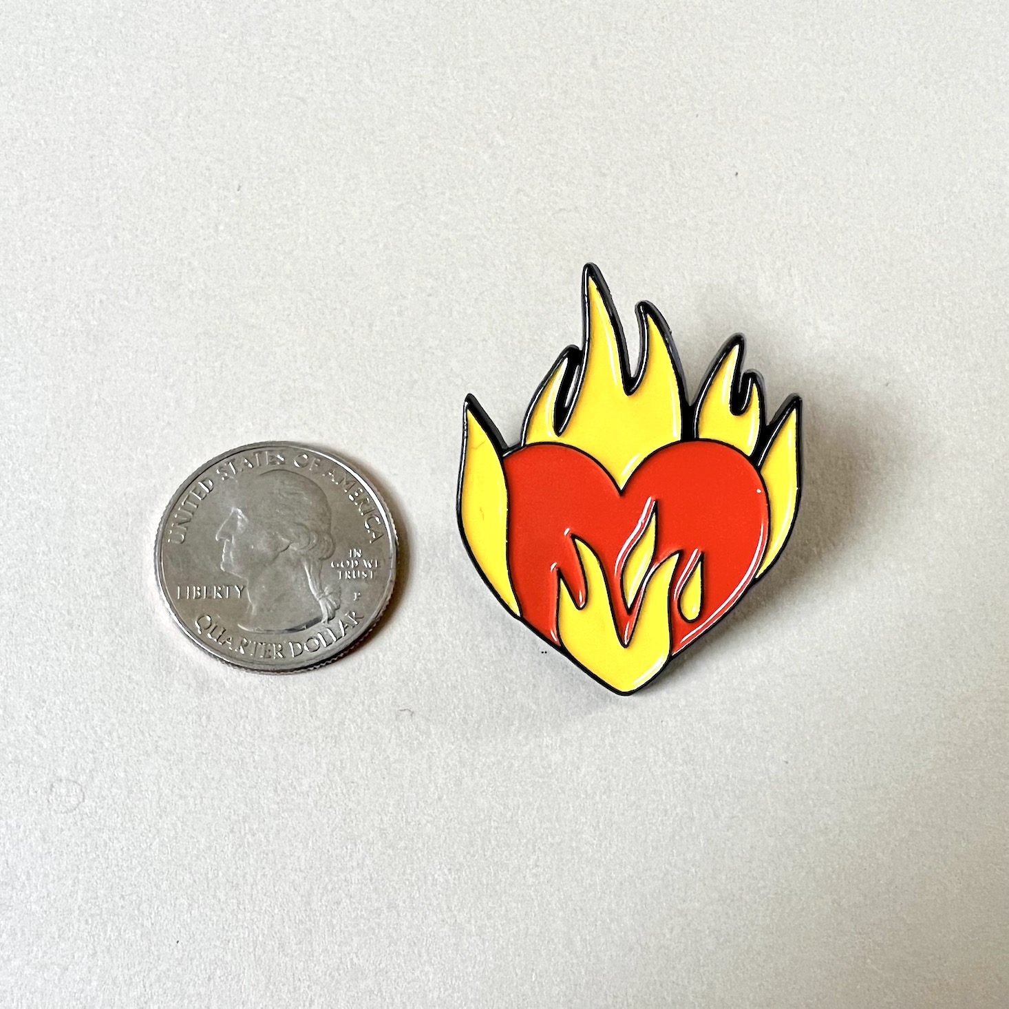 enamel pin, heart with flames