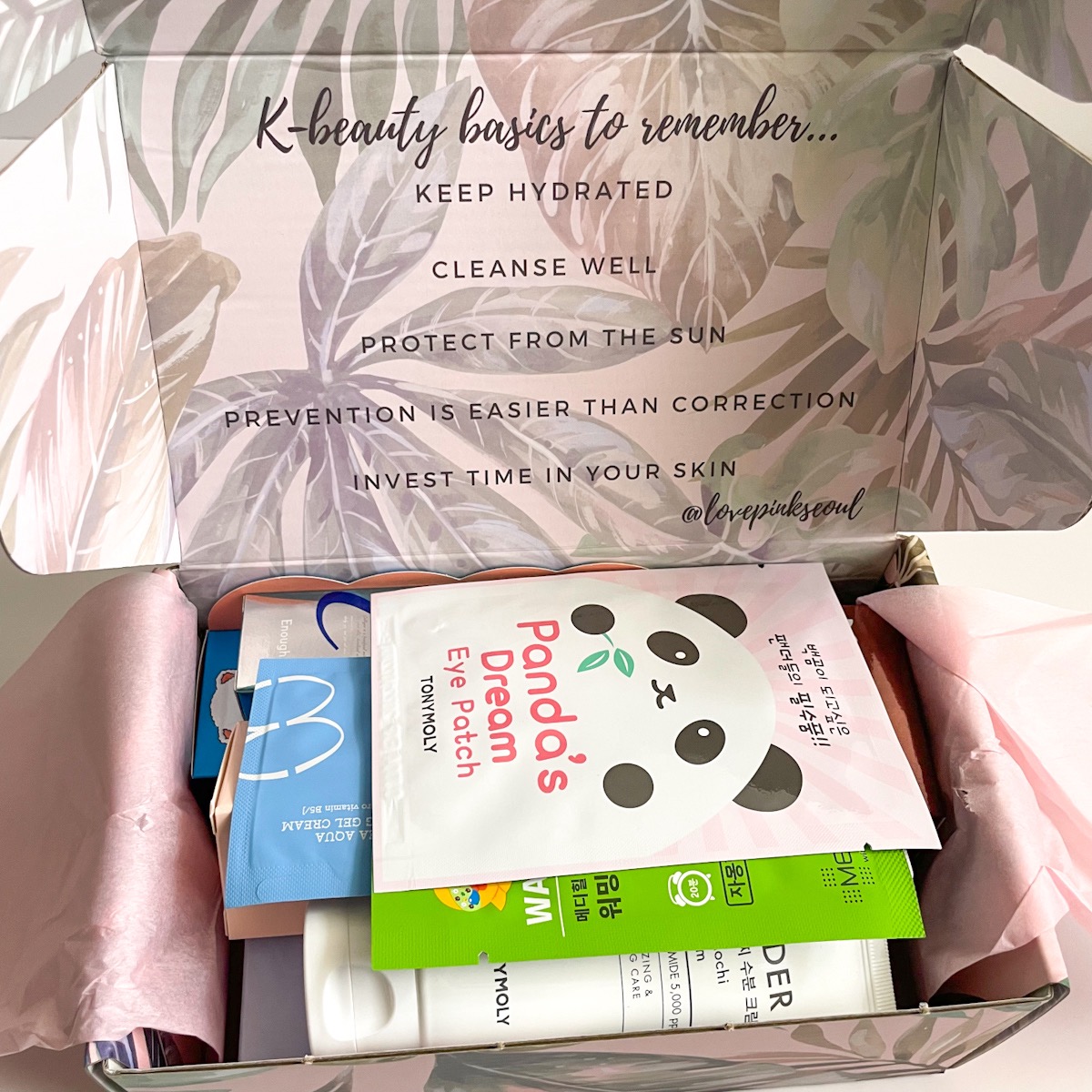 opened pink box showing products inside