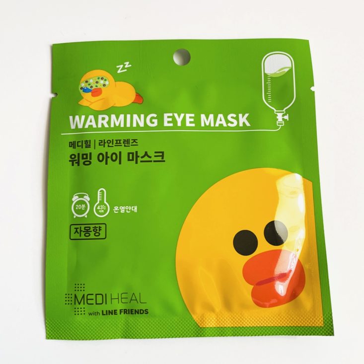 green eye mask with sally chick on front