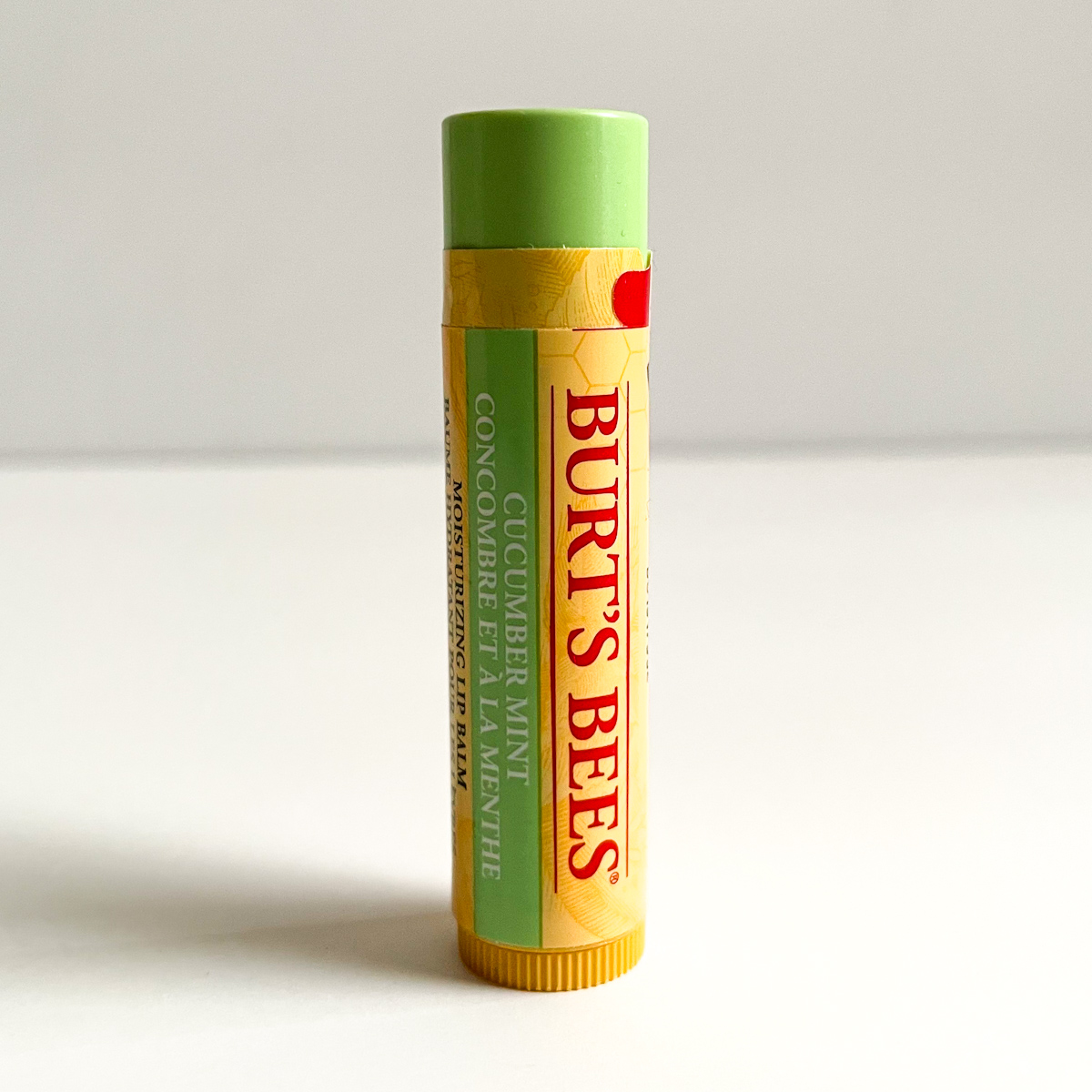 mint and yellow tube of lip balm