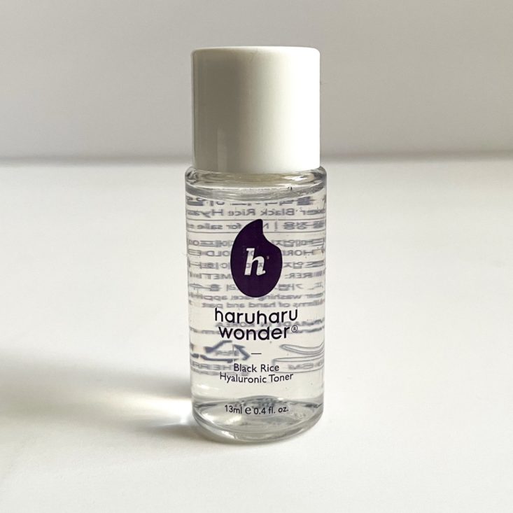 clear bottle of toner with white lid