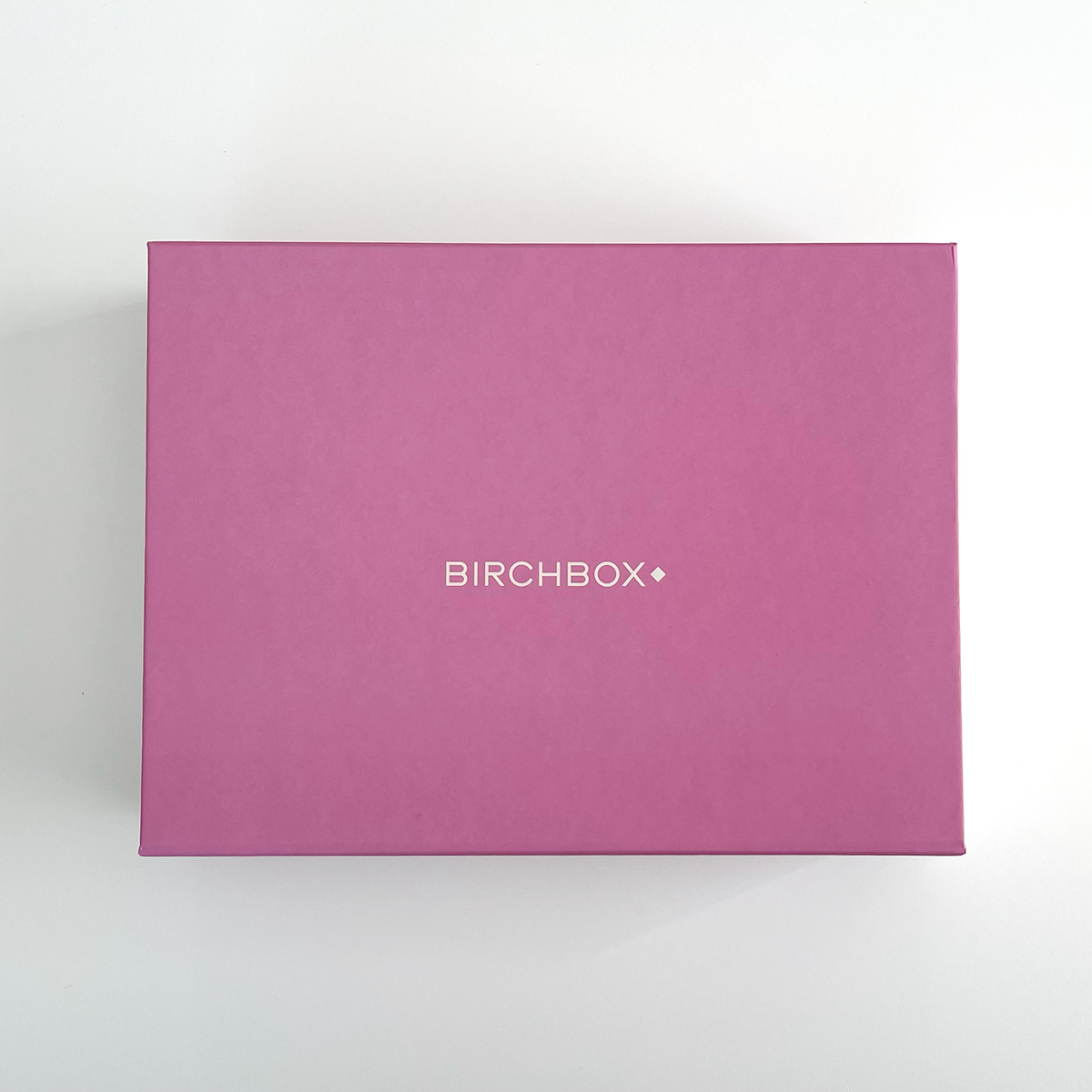 Pink box with Birchbox printed in white text