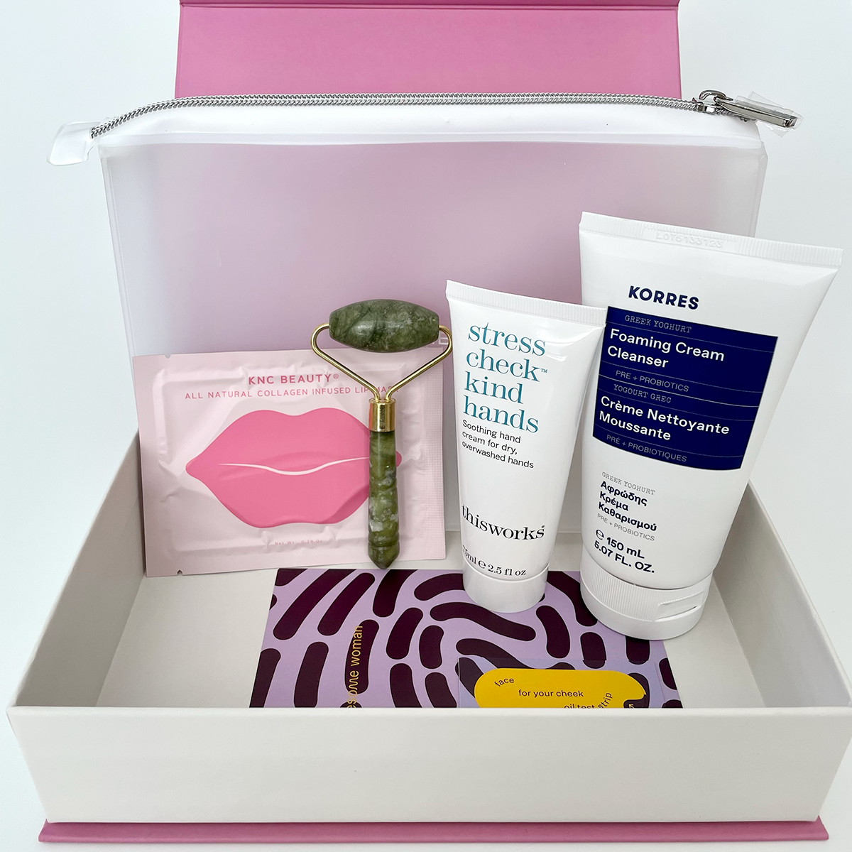 4 beauty products standing upright inside the box