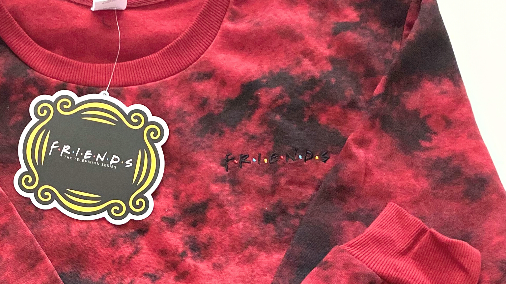 red tie dye shirt with Friends logo