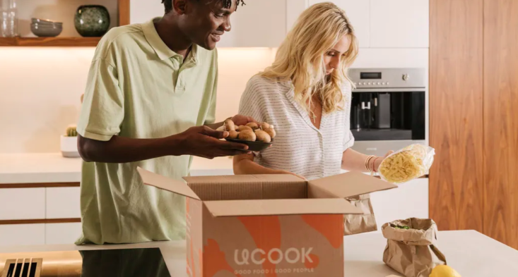 man and woman opening Ucook box