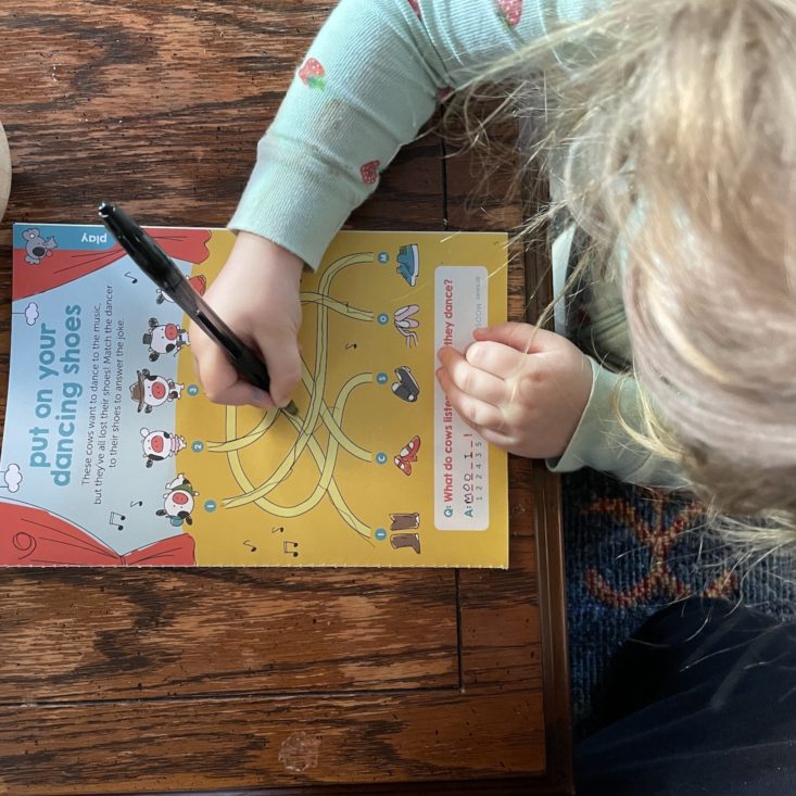 Kid doing a maze-like activity