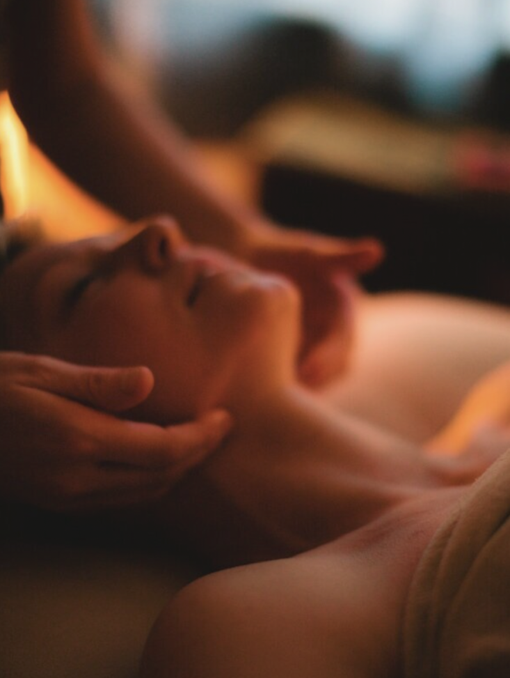 Woman's face being massaged.