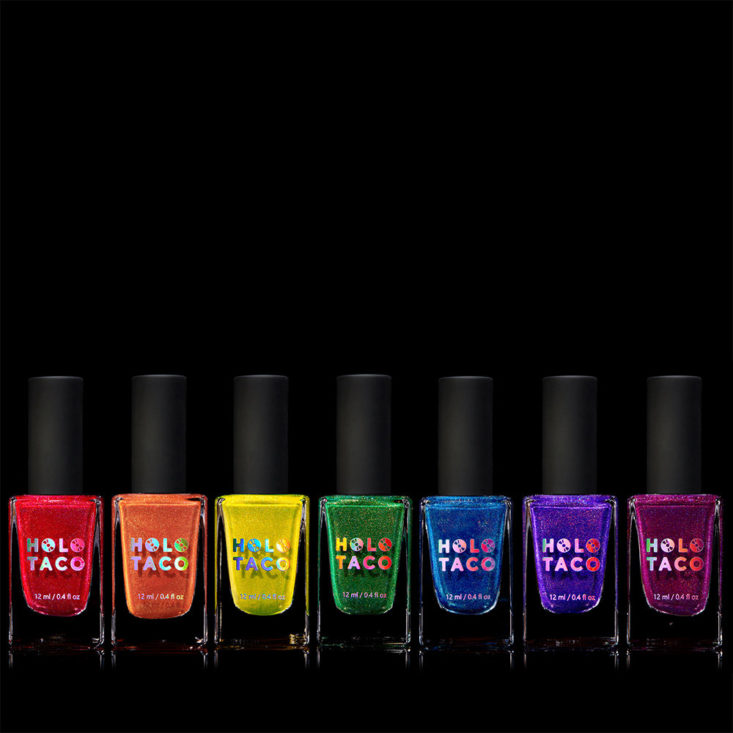 Row of rainbow nail polish bottles.