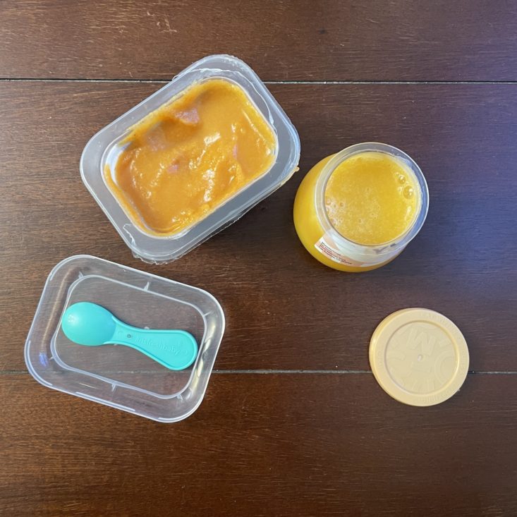 Little Spoon and Yumi baby food, with lids off