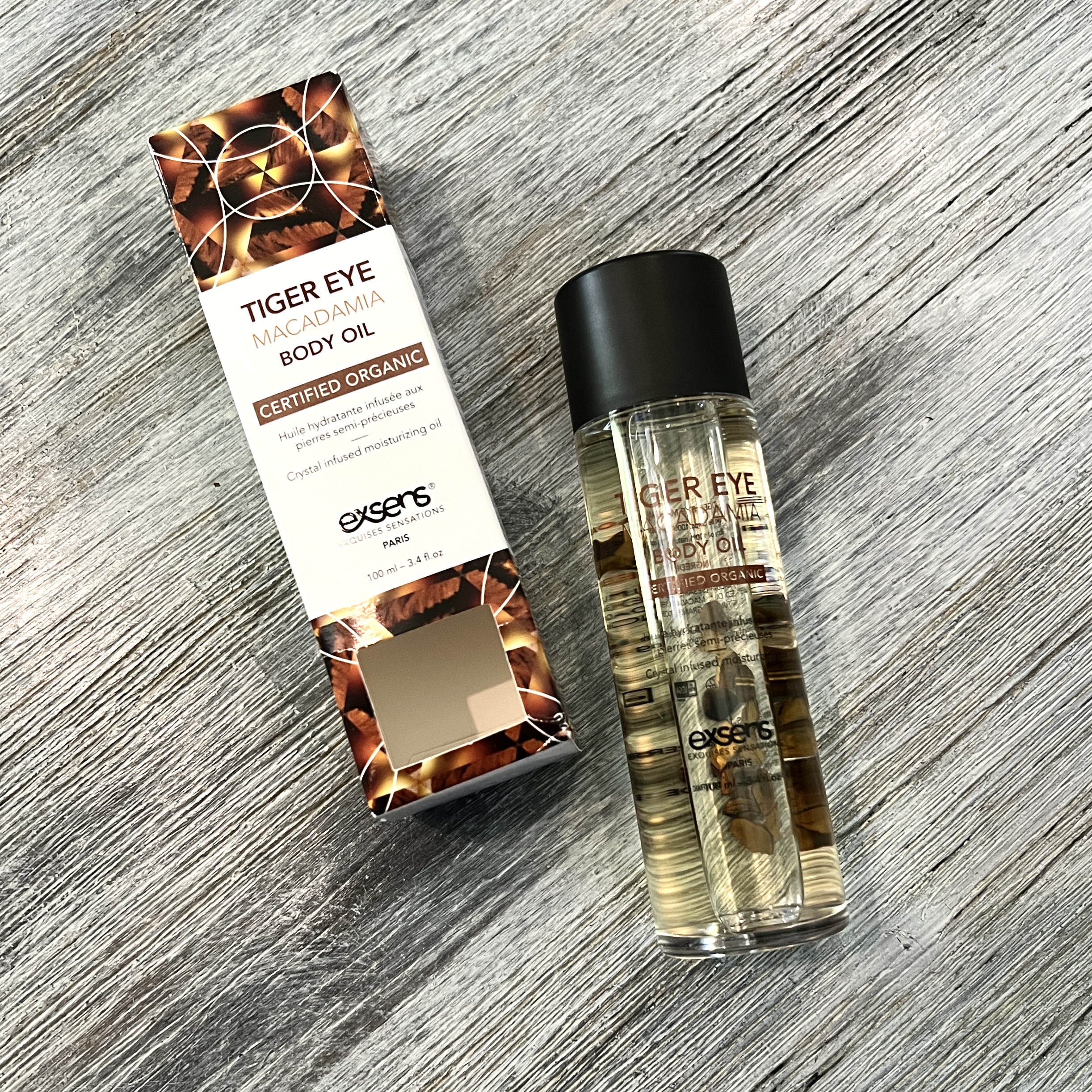 Front of EXSENS Tiger Eye Macadamia Body Oil for Cocotique April 2022