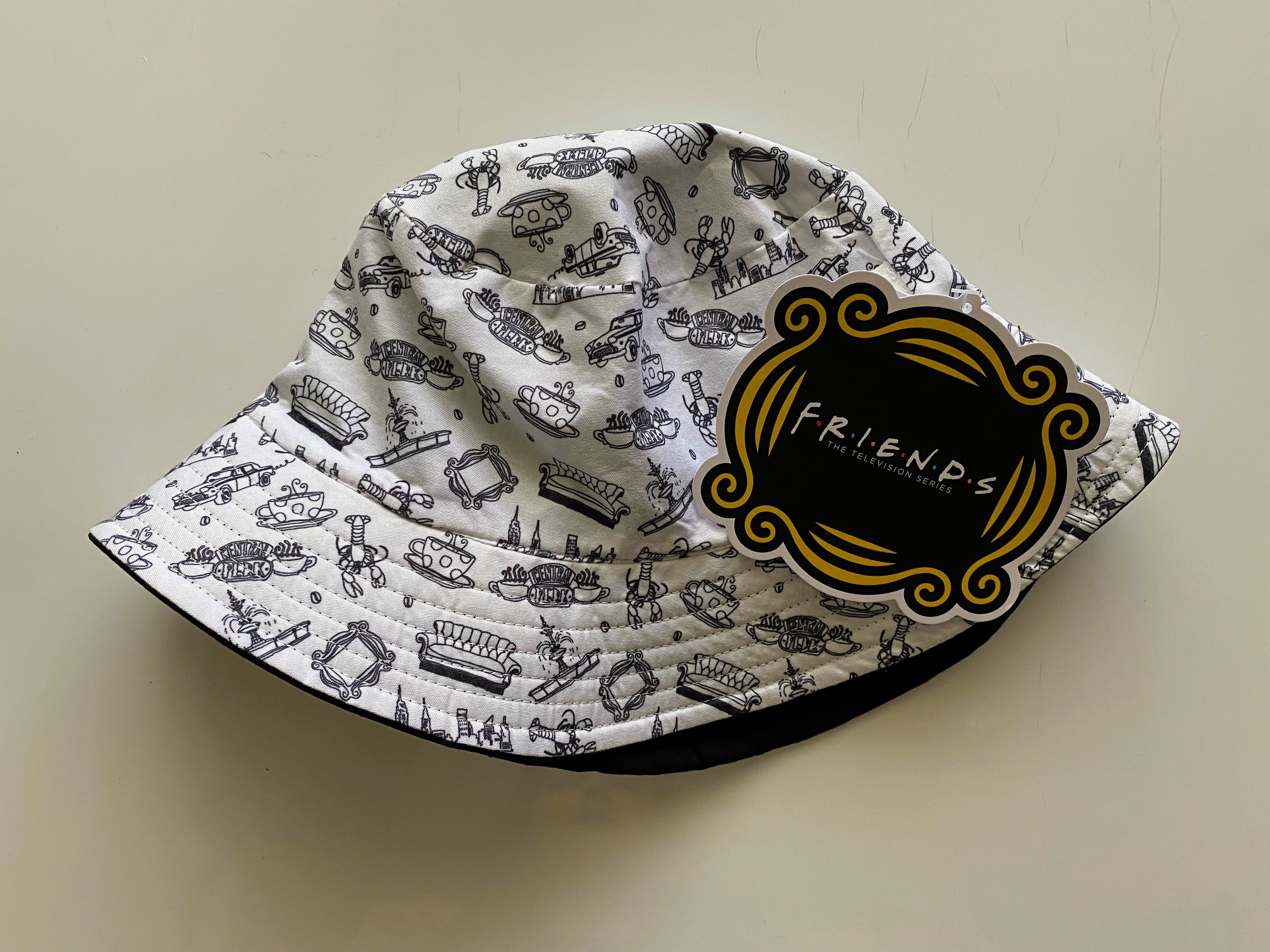 black and white bucket hat with friends tag